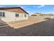 Large backyard with gravel and block wall at 9163 W Swansea Dr, Arizona City, AZ 85123