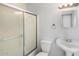 Neat bathroom with tub shower and pedestal sink at 9163 W Swansea Dr, Arizona City, AZ 85123