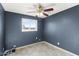 Simple bedroom with tile floors and ceiling fan at 9163 W Swansea Dr, Arizona City, AZ 85123