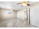 Bright bedroom with tile floors and ceiling fans at 9163 W Swansea Dr, Arizona City, AZ 85123