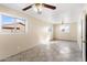 Bright living room with tile floors and ceiling fan at 9163 W Swansea Dr, Arizona City, AZ 85123