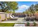 Landscaped backyard with seating area, water feature and modern design at 9280 E Thompson Peak Pkwy # 15, Scottsdale, AZ 85255