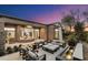 Relaxing patio with seating area and water feature at sunset at 9280 E Thompson Peak Pkwy # 15, Scottsdale, AZ 85255