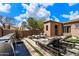 Relaxing backyard oasis with lounge chairs, water feature, and modern design at 9280 E Thompson Peak Pkwy # 15, Scottsdale, AZ 85255