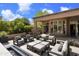 Relaxing backyard patio with seating area, fire pit, and built-in grill at 9280 E Thompson Peak Pkwy # 15, Scottsdale, AZ 85255