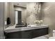 Elegant bathroom with floating vanity, modern lighting, and double sinks at 9280 E Thompson Peak Pkwy # 15, Scottsdale, AZ 85255