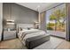 Bright bedroom with large window, gray walls, and modern decor at 9280 E Thompson Peak Pkwy # 15, Scottsdale, AZ 85255