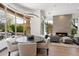 Elegant dining area with a round table and modern light fixture at 9280 E Thompson Peak Pkwy # 15, Scottsdale, AZ 85255