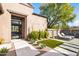 Landscaped front yard with walkway, artificial turf, and modern design at 9280 E Thompson Peak Pkwy # 15, Scottsdale, AZ 85255