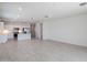 Open concept living room and kitchen with tile floors and sliding glass doors at 9514 N 178Th Dr, Waddell, AZ 85355