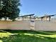 Small backyard with grassy area and orange tree at 9746 N 105Th Dr, Sun City, AZ 85351