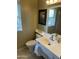 Clean bathroom with single sink vanity and toilet at 9746 N 105Th Dr, Sun City, AZ 85351