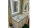 Bathroom with updated vanity and LED mirror at 9746 N 105Th Dr, Sun City, AZ 85351