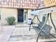 Inviting entryway with a charming swing and tiled flooring at 9746 N 105Th Dr, Sun City, AZ 85351