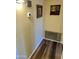 Hallway with framed art and HVAC vent at 9746 N 105Th Dr, Sun City, AZ 85351