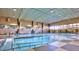 Relaxing indoor swimming pool with seating area at 9746 N 105Th Dr, Sun City, AZ 85351