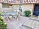 Outdoor patio with table and chairs near the entrance at 9746 N 105Th Dr, Sun City, AZ 85351