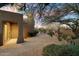 Landscaped backyard with desert plants and a gated entrance at 9926 E Hidden Green Dr, Scottsdale, AZ 85262