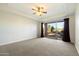 Bedroom with carpet, ceiling fan, and sliding glass doors to the backyard at 9926 E Hidden Green Dr, Scottsdale, AZ 85262