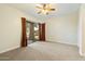 Bright bedroom with sliding glass doors leading to the backyard at 9926 E Hidden Green Dr, Scottsdale, AZ 85262