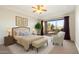 Bright bedroom with a ceiling fan and sliding glass doors to the backyard at 9926 E Hidden Green Dr, Scottsdale, AZ 85262