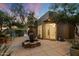 Private courtyard with fountain and seating area, adjacent to home at 9926 E Hidden Green Dr, Scottsdale, AZ 85262