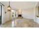 Bright dining room with tile floors, a fireplace, and large windows at 9926 E Hidden Green Dr, Scottsdale, AZ 85262