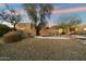 Beautiful desert landscape surrounds this single-story home at 9926 E Hidden Green Dr, Scottsdale, AZ 85262