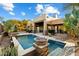 Beautiful pool area with stone accents and fire pit at 9926 E Hidden Green Dr, Scottsdale, AZ 85262