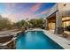 Luxury pool area with fire pit and spacious patio at 9926 E Hidden Green Dr, Scottsdale, AZ 85262