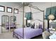 bedroom with canopy bed, mirrored furniture, and ballet barre at 10040 E Happy Valley Rd # 297, Scottsdale, AZ 85255