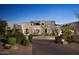 Stunning desert home exterior at dusk, featuring architectural details and landscaping at 10040 E Happy Valley Rd # 297, Scottsdale, AZ 85255