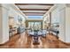 Bright living room with beamed ceilings, a fireplace, and wood floors showcase an elegant design at 10040 E Happy Valley Rd # 297, Scottsdale, AZ 85255