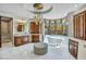 Luxurious bathroom with custom cabinetry, a soaking tub, and a statement chandelier, creating a serene atmosphere at 10040 E Happy Valley Rd # 297, Scottsdale, AZ 85255