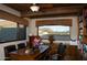 Home office with built-in desk and shelving, mountain views at 10040 E Happy Valley Rd # 297, Scottsdale, AZ 85255