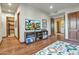 Bright playroom with hardwood floors, custom shelves, and a fun alphabet rug for ' entertainment at 10040 E Happy Valley Rd # 297, Scottsdale, AZ 85255