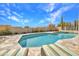 Backyard pool area featuring lounge chairs and a hot tub with desert landscaping at 10040 E Happy Valley Rd # 297, Scottsdale, AZ 85255