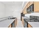 Kitchen with black appliances and light-colored countertops at 1015 S Val Vista Dr # 87, Mesa, AZ 85204