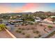 Large desert lot with a house, pool, and RV parking, offering beautiful sunset views at 103 W Tanya Rd, Phoenix, AZ 85086