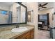 Bathroom with wood vanity, large mirror and view of office at 103 W Tanya Rd, Phoenix, AZ 85086