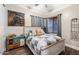 Cozy bedroom with rustic wood bed frame and neutral decor at 103 W Tanya Rd, Phoenix, AZ 85086