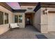 Inviting entryway with a paved patio, a sitting area and a decorative iron door at 103 W Tanya Rd, Phoenix, AZ 85086