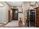 Interior view of the entryway with a wooden door and a decorative metal gate at 103 W Tanya Rd, Phoenix, AZ 85086