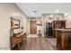 Interior entryway with wooden floors, a rustic console table, and wine refrigerator at 103 W Tanya Rd, Phoenix, AZ 85086