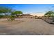 Front exterior view of a single-story home with a large driveway and desert landscaping at 103 W Tanya Rd, Phoenix, AZ 85086