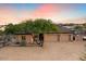 Three-car garage and desert landscaping highlighting this beautiful home at 103 W Tanya Rd, Phoenix, AZ 85086