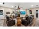 Relaxing living room with leather sofas and a large flat-screen TV at 103 W Tanya Rd, Phoenix, AZ 85086