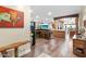 Open concept living space with a rustic wooden bar and a view into the kitchen at 103 W Tanya Rd, Phoenix, AZ 85086