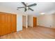 Large bedroom with double doors and hardwood floors at 10927 E Cholla Rd, Mesa, AZ 85207