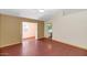 Bright bedroom featuring wood floors and access to a sunroom at 10927 E Cholla Rd, Mesa, AZ 85207